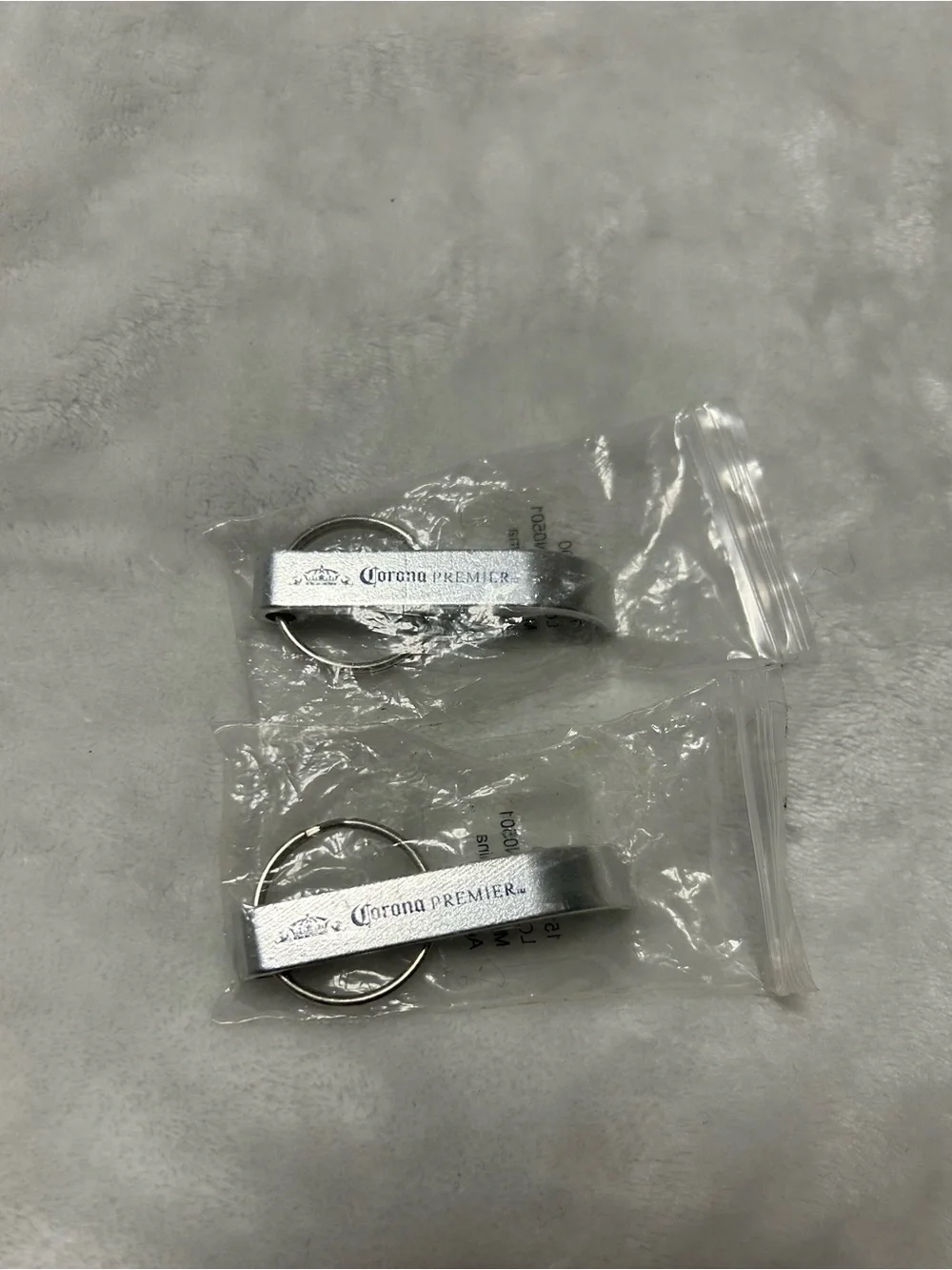 2 metal keychain bottle openers